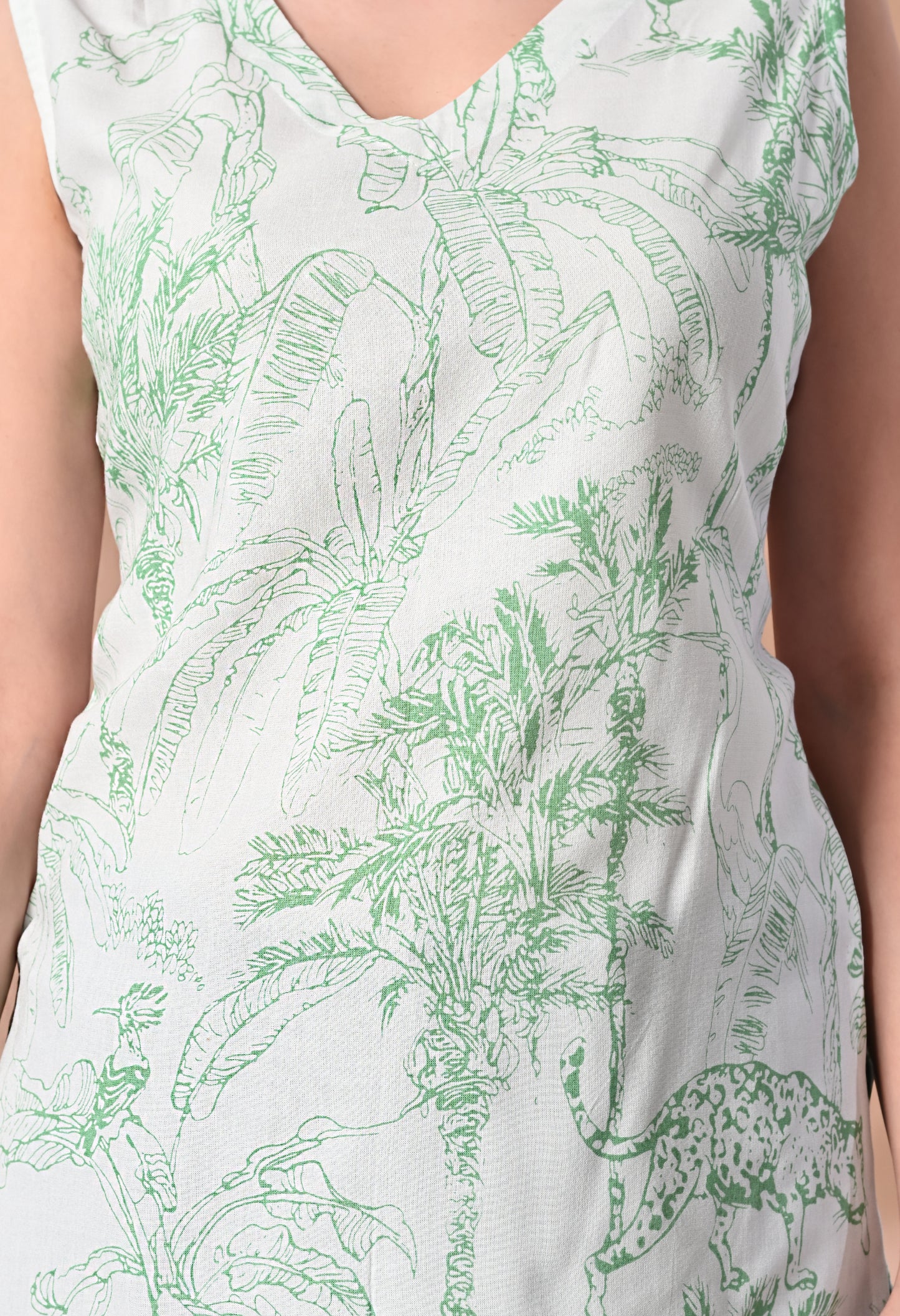 Jungle Chic with Green Animal Print V-Neck White Sleeveless Top
