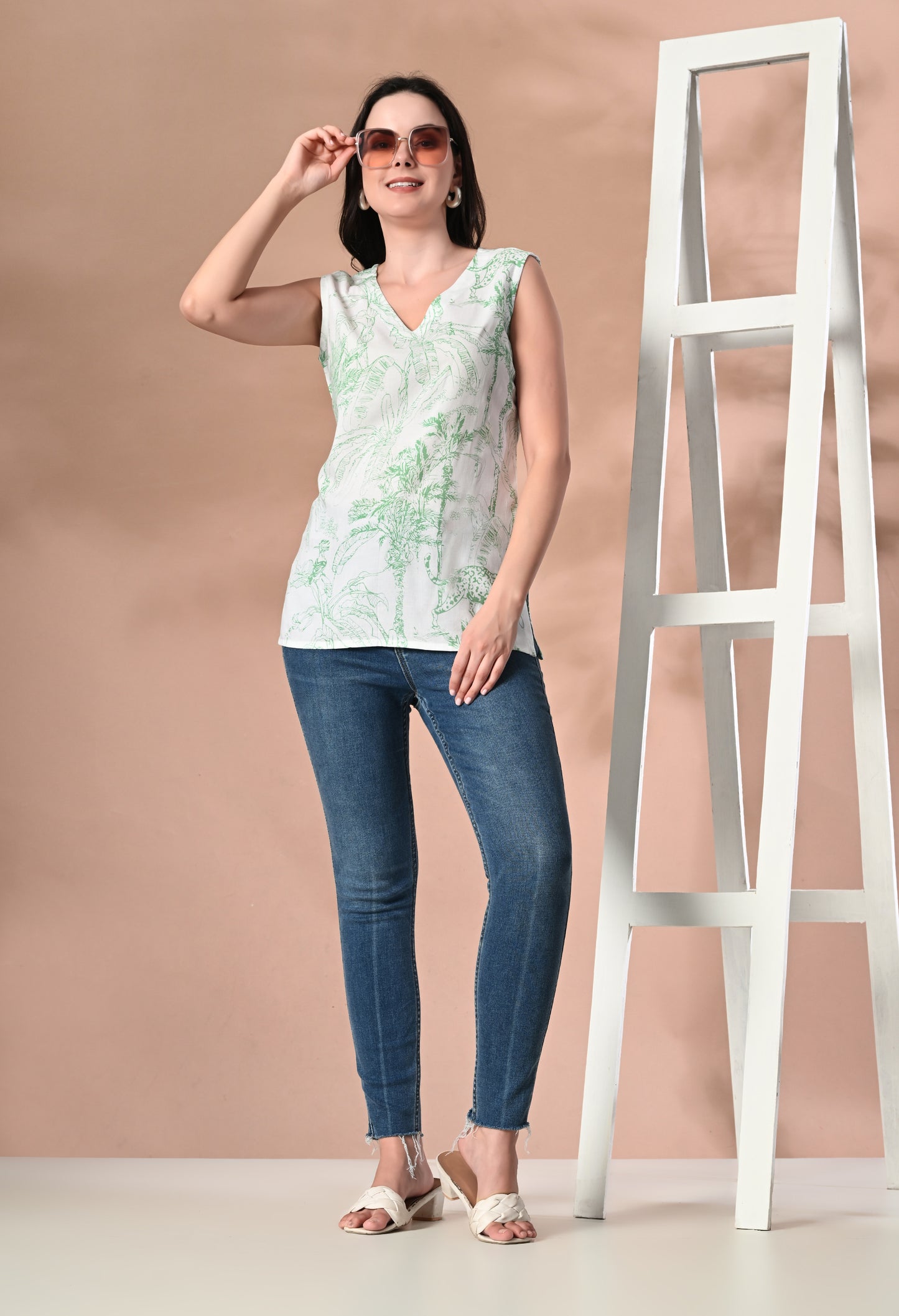 Jungle Chic with Green Animal Print V-Neck White Sleeveless Top